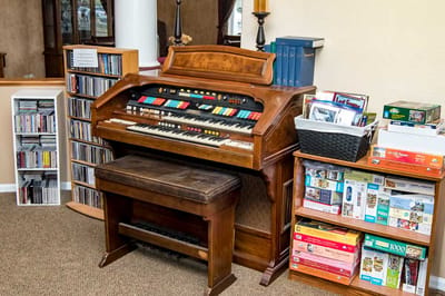 Organ keyboard in a cozy common area setting