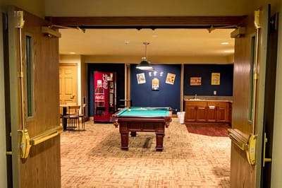 Interior view of a common area with a billiards table