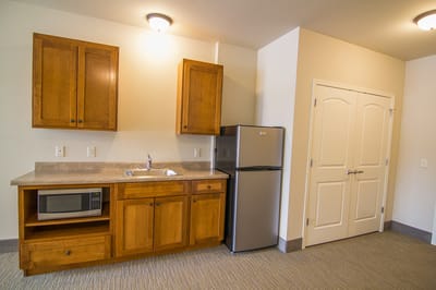 Interior view of a senior living apartment kitchen