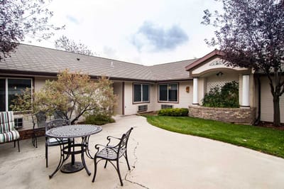 Outdoor patio area with seating and garden