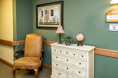 Cozy interior corner with a chair and chest of drawers