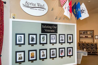 Interior wall honoring veterans with framed photos