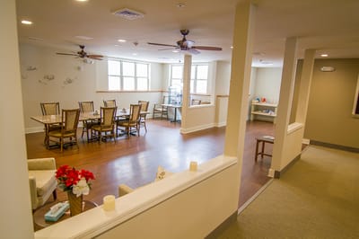 Bright common area with seating and tables