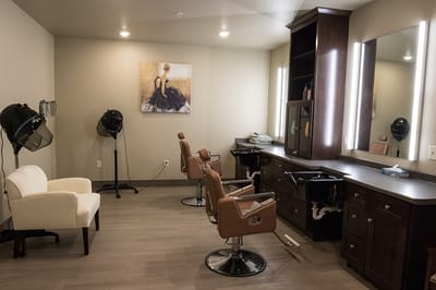 Interior of a facility hair salon with styling chairs