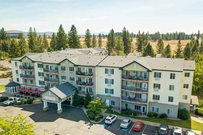 Aerial view of North Point Village facility with outdoor space and parking