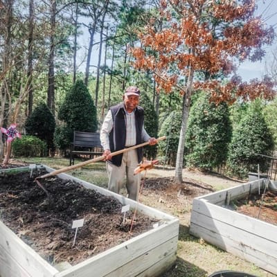 Resident gardening in an outdoor space