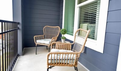 Cozy outdoor balcony seating with a view