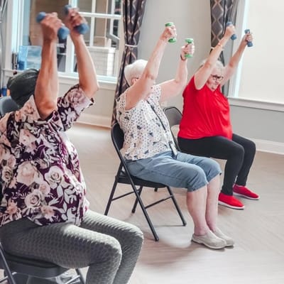 Residents participating in an exercise class with weights