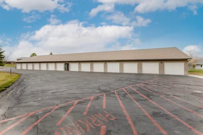 Building exterior with parking area