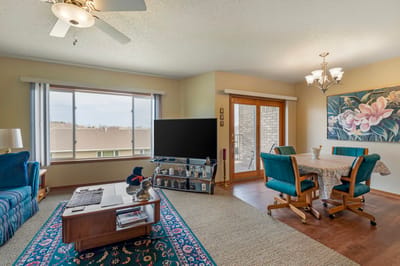 Bright common area with seating and dining space