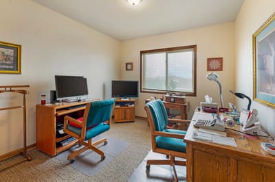 A private resident room with furniture and computers