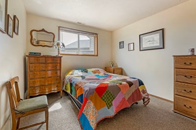 Cozy bedroom with a colorful quilt