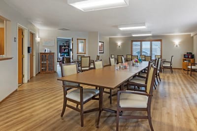 Bright common area with tables and chairs for socializing