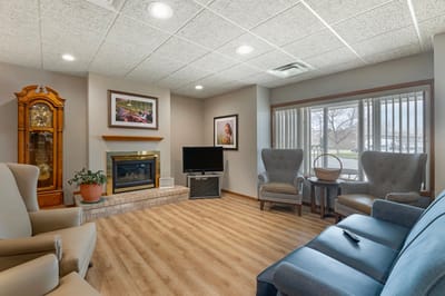 Comfortable common area with seating and a fireplace