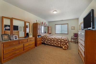 Private resident room with a bed and furniture