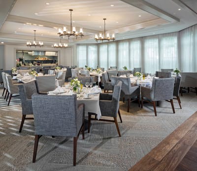Elegant dining room with tables set for a meal