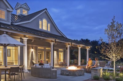 Residents enjoying an outdoor fire pit in the evening