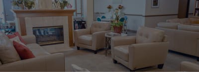 Cozy common area with comfortable seating and a fireplace