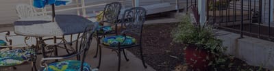 Outdoor patio area with tables and chairs