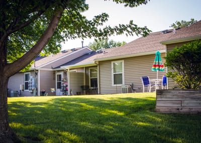 Outdoor view of resident homes with landscaped yard