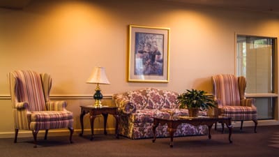 Seating area in a common room with floral patterns