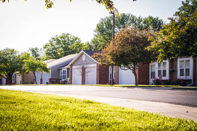 Outdoor view of a senior living facility with greenery