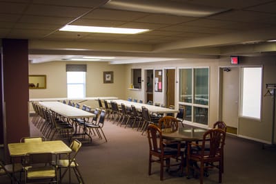Common area with seating and tables in an interior space