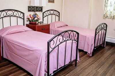 Bedroom with two beds and floral decor