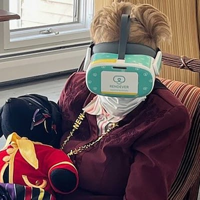 Resident experiencing virtual reality with headset