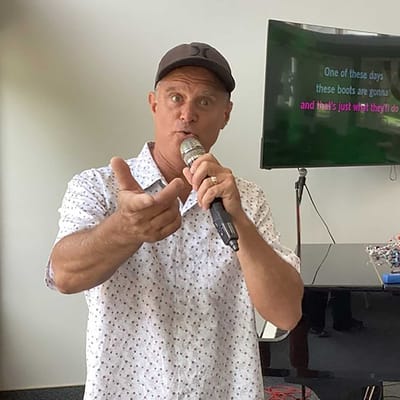 Entertainer performing for residents in a common area