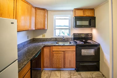 Interior view of a kitchen with cabinets and appliances