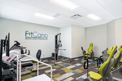 Fitness room with exercise equipment and bright decor