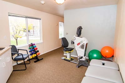 Interior room with exercise equipment and weights
