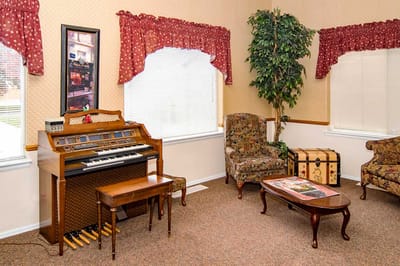 Interior common area with a piano and seating