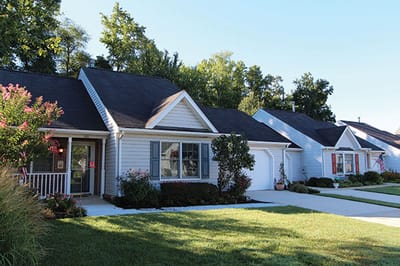 Exterior view of assisted living cottages with landscaping