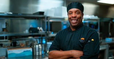 Chef smiling in a kitchen setting at Epworth Villa