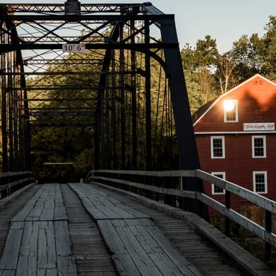 A scenic bridge leading to a building