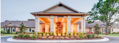 Exterior view of Village on the Park Rogers entrance
