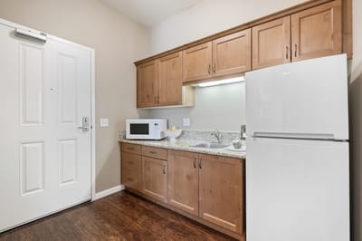 A kitchenette area in a private resident room