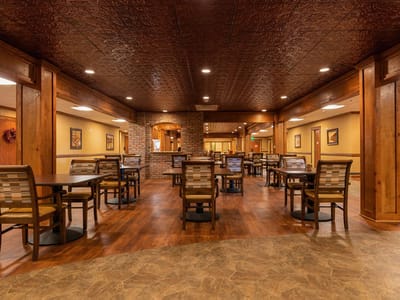 Interior dining room with wooden decor and seating