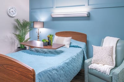 Comfortable resident room with bedside amenities
