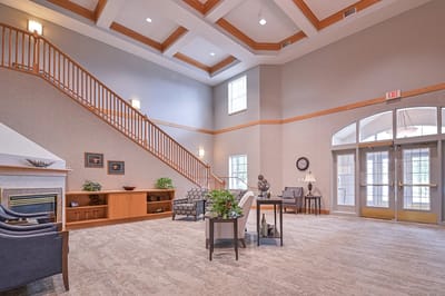 Bright and welcoming common area with seating and stairs
