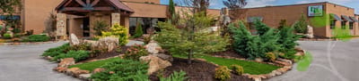 Entrance of Liberty Park Senior Living with landscaped gardens