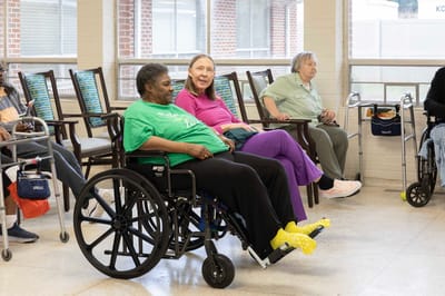 Residents sitting in a bright common area