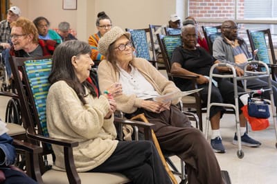 Residents participating in a group activity in a common area