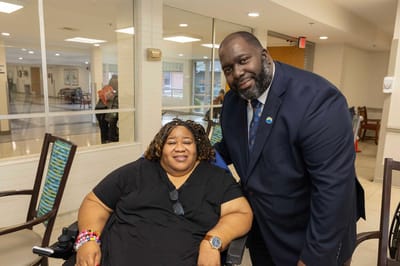 Staff member with a resident in a common area