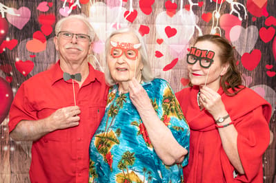 Residents enjoying a themed photo booth at an event