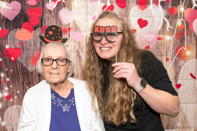 Residents enjoying a photo booth during a celebration