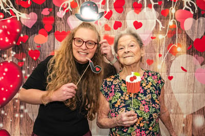 Residents celebrating with props at a festive event