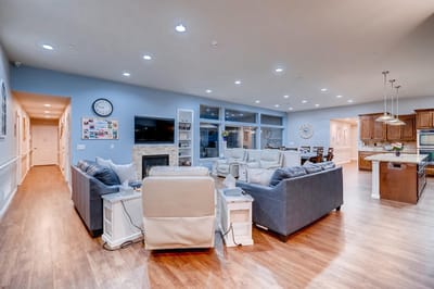 Common area with seating and kitchen visible